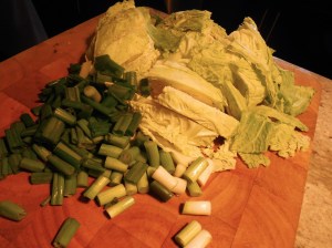 Chopped savoy cabbage and scallions ready for the braise.