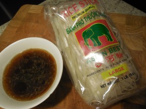 Package of Asian rice noodles and the premixed sauce.
