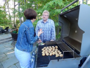 Karen and Russ discussing the merits of grilling the baguette rounds.
